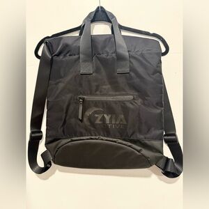 NWOT Zyia Backpack Active Vooray Cinch Black Nylon Pockets Yoga Bucket Bag